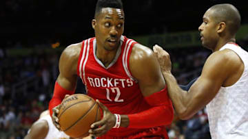 Mar 19, 2016; Atlanta, GA, USA; Houston Rockets center Dwight Howard (12) is defended by Atlanta Hawks center Al Horford (15) in the first quarter at Philips Arena. Mandatory Credit: Brett Davis-USA TODAY Sports