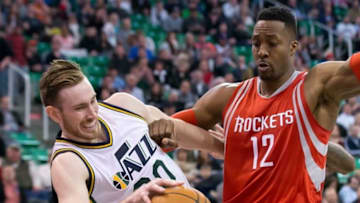 Feb 23, 2016; Salt Lake City, UT, USA; Utah Jazz forward Gordon Hayward (20) is fouled by Houston Rockets center Dwight Howard (12) during overtime at Vivint Smart Home Arena. Utah won 117-114. Mandatory Credit: Russ Isabella-USA TODAY Sports