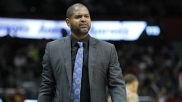 Mar 19, 2016; Atlanta, GA, USA; Houston Rockets head coach J.B. Bickerstaff talks to a referee against the Atlanta Hawks in the second quarter at Philips Arena. Mandatory Credit: Brett Davis-USA TODAY Sports