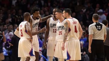 Jan 18, 2016; Los Angeles, CA, USA; Los Angeles Clippers players Chris Paul (3) and DeAndre Jordan (6), forward Luc Richard Mbah a Moute (12) and Austin Rivers (25) and J.J. Redick (4) huddle during an NBA basketball game against the Houston Rockets at Staples Center. The Clippers defeated the Rockers 140-132 in overtime. Mandatory Credit: Kirby Lee-USA TODAY Sports