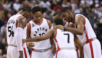 Mar 14, 2016; Toronto, Ontario, CAN; Toronto Raptors point guard Kyle Lowry (7) talks with forward Patrick Patterson (54) and guard DeMar DeRozan (10) and guard Norman Powell (24) and forward Jason Thompson (1) during the first half against the Chicago Bulls at Air Canada Centre. The Bulls beat the Raptors 109-107. Mandatory Credit: Tom Szczerbowski-USA TODAY Sports