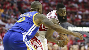 Apr 21, 2016; Houston, TX, USA; Houston Rockets guard James Harden (13) holds the ball as Golden State Warriors forward Andre Iguodala (9) defends during the fourth quarter in game three of the first round of the NBA Playoffs at Toyota Center. The Rockets won 97-96. Mandatory Credit: Troy Taormina-USA TODAY Sports