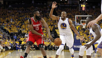 Apr 18, 2016; Oakland, CA, USA; Houston Rockets guard James Harden (13) passes the ball away from Golden State Warriors guard Andre Iguodala (9) in the second quarter in game two of the first round of the NBA Playoffs at Oracle Arena. Mandatory Credit: Cary Edmondson-USA TODAY Sports