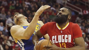 Dec 31, 2015; Houston, TX, USA; Houston Rockets guard James Harden (13) is called for charging against Golden State Warriors center Andrew Bogut (12) in the first quarter at Toyota Center. Mandatory Credit: Thomas B. Shea-USA TODAY Sports