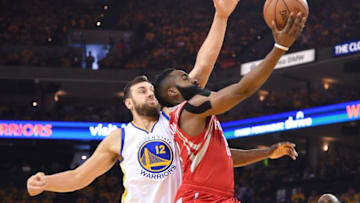 April 16, 2016; Oakland, CA, USA; Houston Rockets guard James Harden (13) shoots the basketball against Golden State Warriors center Andrew Bogut (12) during the first quarter in game one of the first round of the NBA Playoffs at Oracle Arena. Mandatory Credit: Kyle Terada-USA TODAY Sports