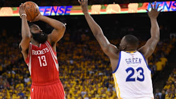 April 16, 2016; Oakland, CA, USA; Houston Rockets guard James Harden (13) shoots the basketball against Golden State Warriors forward Draymond Green (23) during the first quarter in game one of the first round of the NBA Playoffs at Oracle Arena. Mandatory Credit: Kyle Terada-USA TODAY Sports