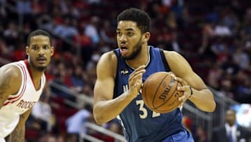 Mar 18, 2016; Houston, TX, USA; Minnesota Timberwolves center Karl-Anthony Towns (32) dribbles the ball during the second half against the Houston Rockets at Toyota Center. The Rockets won 116-111. Mandatory Credit: Troy Taormina-USA TODAY Sports