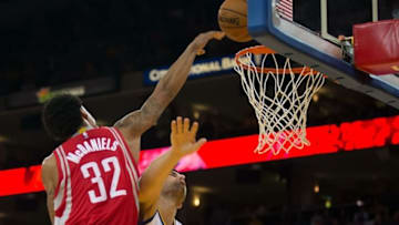 Oct 15, 2015; Oakland, CA, USA; Houston Rockets guard K.J. McDaniels (32) dunks the ball against Golden State Warriors center Andrew Bogut (12) during the second quarter at Oracle Arena. Mandatory Credit: Kelley L Cox-USA TODAY Sports