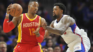 May 8, 2015; Los Angeles, CA, USA; Houston Rockets center Dwight Howard (12) controls the ball against the defense of Los Angeles Clippers center DeAndre Jordan (6) during the second half in game three of the second round of the NBA Playoffs. at Staples Center. Mandatory Credit: Gary A. Vasquez-USA TODAY Sports