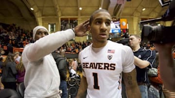 Jan 9, 2016; Corvallis, OR, USA; Oregon State Beavers guard Gary Payton II (1) celebrates with his father and former NBA star Gary Payton after the game against the California Golden Bears at Gill Coliseum. The Beavers won 77-71. Mandatory Credit: Troy Wayrynen-USA TODAY Sports