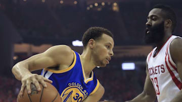 May 25, 2015; Houston, TX, USA; Golden State Warriors guard Stephen Curry (30) looks to drive as Houston Rockets guard James Harden (13) defends during the first quarter in game four of the Western Conference Finals of the NBA Playoffs. at Toyota Center. Mandatory Credit: Thomas B. Shea-USA TODAY Sports