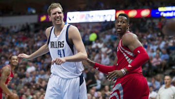 Apr 6, 2016; Dallas, TX, USA; Dallas Mavericks forward Dirk Nowitzki (41) reacts to a call as Houston Rockets center Dwight Howard (12) looks on during the second half at the American Airlines Center. The Mavericks defeat the Rockets 88-86. Mandatory Credit: Jerome Miron-USA TODAY Sports