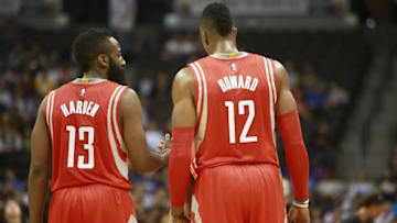 Dec 17, 2014; Denver, CO, USA; Houston Rockets center Dwight Howard (right) and guard James Harden (left) talk during the first half against the Denver Nuggets at Pepsi Center. Mandatory Credit: Chris Humphreys-USA TODAY Sports