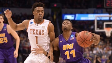 Mar 18, 2016; Oklahoma City, OK, USA; Northern Iowa Panthers guard Wes Washpun (11) drives against Texas Longhorns guard Isaiah Taylor (1) in the first half during the first round of the 2016 NCAA Tournament at Chesapeake Energy Arena. Mandatory Credit: Mark D. Smith-USA TODAY Sports