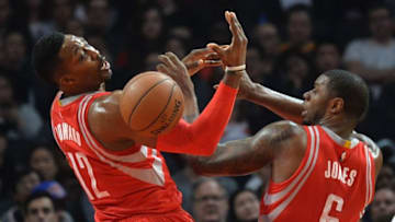 Jan 18, 2016; Los Angeles, CA, USA; Houston Rockets center Dwight Howard (12) and forward Terrence Jones (6) battle for a rebound during an NBA basketball game against the Los Angeles Clippers at Staples Center. Mandatory Credit: Kirby Lee-USA TODAY Sports