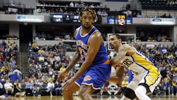 Apr 12, 2016; Indianapolis, IN, USA; New York Knicks forward Derrick Williams (23) is guarded by Indiana Pacers guard George Hill (3) at Bankers Life Fieldhouse. Indiana defeats New York 102-90. Mandatory Credit: Brian Spurlock-USA TODAY Sports