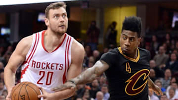 Mar 29, 2016; Cleveland, OH, USA; Houston Rockets forward Donatas Motiejunas (20) drives and Cleveland Cavaliers guard Iman Shumpert (4) defends during the first quarter at Quicken Loans Arena. Mandatory Credit: Ken Blaze-USA TODAY Sports