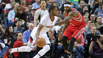 Feb 10, 2016; Portland, OR, USA; Portland Trail Blazers forward Maurice Harkless (4) dribbles past Houston Rockets center Josh Smith (5) during the first quarter at the Moda Center. Mandatory Credit: Craig Mitchelldyer-USA TODAY Sports