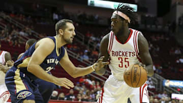 Oct 19, 2015; Houston, TX, USA; Houston Rockets forward Montrezl Harrell (35) drives the ball during the first quarter as New Orleans Pelicans forward Ryan Anderson (33) defends at Toyota Center. Mandatory Credit: Troy Taormina-USA TODAY Sports