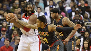 Apr 13, 2016; Washington, DC, USA; Washington Wizards center Nene Hilario (42) looks to pass as Atlanta Hawks forward Kent Bazemore (24) attempts to steal the ball during the second half at Verizon Center. Washington Wizards defeated Atlanta Hawks 109-98. Mandatory Credit: Tommy Gilligan-USA TODAY Sports