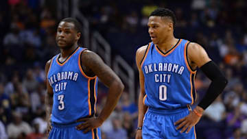 Feb 8, 2016; Phoenix, AZ, USA; Oklahoma City Thunder guard Russell Westbrook (0) talks with guard Dion Waiters (3) during the first half against the Phoenix Suns at Talking Stick Resort Arena. Mandatory Credit: Jennifer Stewart-USA TODAY Sports