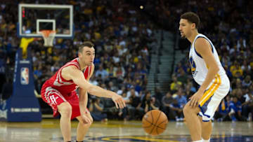 Oct 15, 2015; Oakland, CA, USA; Houston Rockets forward Sam Dekker (7) passes the ball against Golden State Warriors guard Klay Thompson (11) during the second quarter at Oracle Arena. Mandatory Credit: Kelley L Cox-USA TODAY Sports