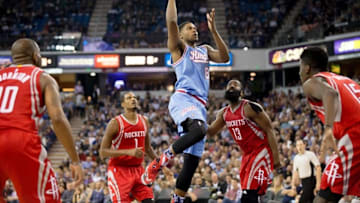 Nov 6, 2015; Sacramento, CA, USA; Sacramento Kings forward Rudy Gay (8) goes up for a layup between Houston Rockets guard Marcus Thornton (10), forward Trevor Ariza (1), guard James Harden (13) and center Clint Capela (15) during the fourth quarter at Sleep Train Arena. The Houston Rockets defeated the Sacramento Kings 116-110. Mandatory Credit: Kelley L Cox-USA TODAY Sports