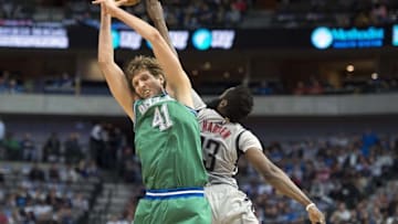 Dec 4, 2015; Dallas, TX, USA; Dallas Mavericks forward Dirk Nowitzki (41) and Houston Rockets guard James Harden (13) jump for the loose ball during the first quarter at the American Airlines Center. Mandatory Credit: Jerome Miron-USA TODAY Sports
