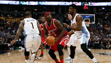 Nov 13, 2015; Denver, CO, USA; Denver Nuggets guard Emmanuel Mudiay (0) guards Houston Rockets guard Ty Lawson (3) in the fourth quarter at the Pepsi Center. Mandatory Credit: Isaiah J. Downing-USA TODAY Sports