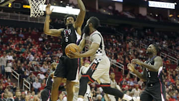 Dec 19, 2015; Houston, TX, USA; Houston Rockets guard James Harden (13) looks to make a pass against Los Angeles Clippers center DeAndre Jordan (6) in the first half at Toyota Center. Mandatory Credit: Thomas B. Shea-USA TODAY Sports