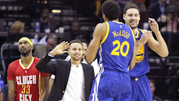 Dec 31, 2015; Houston, TX, USA; Golden State Warriors Stephan Curry high fives his teammates during a Houston Rockets timeout in the second half at Toyota Center. The Warriors won 114 to 110. Mandatory Credit: Thomas B. Shea-USA TODAY Sports