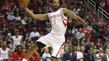 Jan 10, 2016; Houston, TX, USA; Houston Rockets forward Trevor Ariza (1) attempts to save a ball from going out of bounds during the third quarter against the Indiana Pacers at Toyota Center. The Rockets won 107-103 in overtime. Mandatory Credit: Troy Taormina-USA TODAY Sports