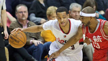 Feb 10, 2016; Portland, OR, USA; Portland Trail Blazers guard C.J. McCollum (3) drives past Houston Rockets guard Corey Brewer (33) during the third quarter at the Moda Center. Mandatory Credit: Craig Mitchelldyer-USA TODAY Sports