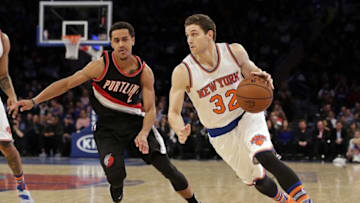 Mar 1, 2016; New York, NY, USA; New York Knicks guard Jimmer Fredette (32) drives to the basket past Portland Trail Blazers guard Brian Roberts (2) during the second half at Madison Square Garden. The Trail Blazers defeated the Knicks 104-85. Mandatory Credit: Adam Hunger-USA TODAY Sports