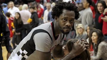 Mar 2, 2016; Houston, TX, USA; Houston Rockets guard Patrick Beverley (2) hugs a fan after defeating the New Orleans Pelicans at Toyota Center. The Rockets won 100-95. Mandatory Credit: Thomas B. Shea-USA TODAY Sports