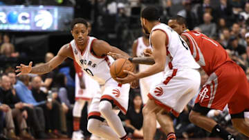 Mar 6, 2016; Toronto, Ontario, CAN; Toronto Raptors guards DeMar DeRozan (10) and Cory Joseph (6) work the ball past Houston Rockets forward Trevor Ariza (1) in the second quarter at Air Canada Centre. Mandatory Credit: Dan Hamilton-USA TODAY Sports