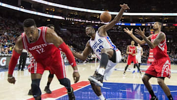 Mar 9, 2016; Philadelphia, PA, USA; Houston Rockets center Dwight Howard (12) knocks the ball away from Philadelphia 76ers forward Jerami Grant (39) as he drives to the basket during the first half at Wells Fargo Center. The Houston Rockets won 118-104. Mandatory Credit: Bill Streicher-USA TODAY Sports