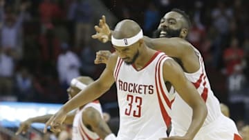 Nov 18, 2015; Houston, TX, USA; Houston Rockets guard Corey Brewer (33) and guard James Harden (13) react following a three point basket by Brewer to tie the game in regulation against the Portland Trail Blazers in the fourth quarter at Toyota Center. The Rockets won in overtime 108-103. Mandatory Credit: Thomas B. Shea-USA TODAY Sports