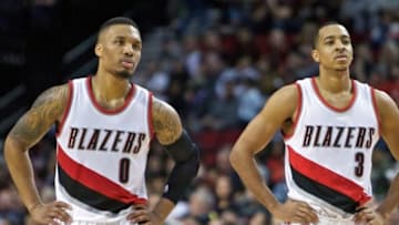 Jan 29, 2016; Portland, OR, USA; Portland Trail Blazers guard Damian Lillard (0) and guard C.J. McCollum (3) look on against the Charlotte Hornets during the fourth quarter at the Moda Center. Mandatory Credit: Craig Mitchelldyer-USA TODAY Sports