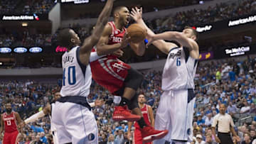 Oct 28, 2016; Dallas, TX, USA; Houston Rockets guard Eric Gordon (10) drives to the basket between Dallas Mavericks forward Harrison Barnes (40) and center Andrew Bogut (6) during the second half at the American Airlines Center. The Rockets defeat the Mavericks 106-98. Mandatory Credit: Jerome Miron-USA TODAY Sports