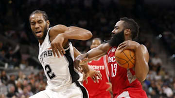 Nov 9, 2016; San Antonio, TX, USA; Houston Rockets shooting guard James Harden (13) drives to the basket while guarded by San Antonio Spurs small forward Kawhi Leonard (2) during the second half at AT&T Center. The rockets won 101-99. Mandatory Credit: Soobum Im-USA TODAY Sports