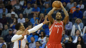 Nov 16, 2016; Oklahoma City, OK, USA; Houston Rockets forward Trevor Ariza (1) shoots the ball over Oklahoma City Thunder guard Russell Westbrook (0) during the first quarter at Chesapeake Energy Arena. Mandatory Credit: Mark D. Smith-USA TODAY Sports