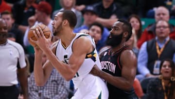 Nov 29, 2016; Salt Lake City, UT, USA; Utah Jazz center Rudy Gobert (27) keeps the ball away from Houston Rockets guard James Harden (13) during the second quarter at Vivint Smart Home Arena. Mandatory Credit: Chris Nicoll-USA TODAY Sports