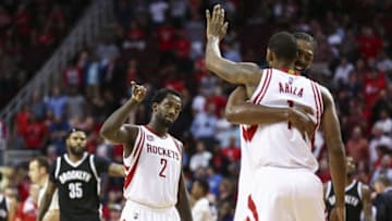 Dec 12, 2016; Houston, TX, USA; Houston Rockets guard Patrick Beverley (2) celebrates with forward Trevor Ariza (1) after a play during the fourth quarter against the Brooklyn Nets at Toyota Center. Mandatory Credit: Troy Taormina-USA TODAY Sports