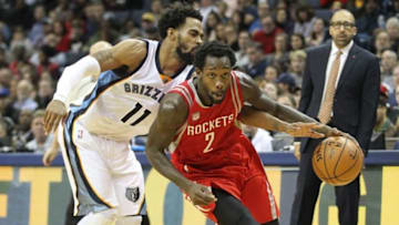Dec 23, 2016; Memphis, TN, USA; Houston Rockets guard Patrick Beverley (2) drives as Memphis Grizzlies Mike Conley (11) attempts a steal the ball in the second half at FedExForum. Memphis defeated Houston 115-109. Mandatory Credit: Nelson Chenault-USA TODAY Sports
