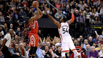 Jan 8, 2017; Toronto, Ontario, CAN; Houston Rockets guard James Harden (13) takes a shot as Toronto Raptors forward Patrick Patterson (54) defends during the second half at Air Canada Centre. Mandatory Credit: Dan Hamilton-USA TODAY Sports