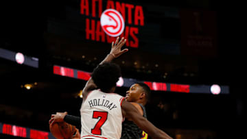 ATLANTA, GA - OCTOBER 27: Kent Bazemore #24 of the Atlanta Hawks drives against Justin Holiday #7 of the Chicago Bulls at State Farm Arena on October 27, 2018 in Atlanta, Georgia. NOTE TO USER: User expressly acknowledges and agrees that, by downloading and or using this photograph, User is consenting to the terms and conditions of the Getty Images License Agreement. (Photo by Kevin C. Cox/Getty Images)