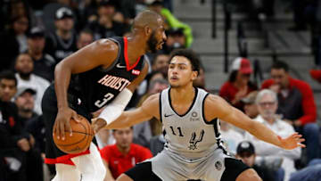 SAN ANTONIO, TX - NOVEMBER 30: Chris Paul #3 of the Houston Rockets looks for around Bryn Forbes #11 of the San Antonio Spurs during an NBA game held November 30, 2018 at the AT&T Center in San Antonio, Texas. NOTE TO USER: User expressly acknowledges and agrees that, by downloading and or using this photograph, User is consenting to the terms and conditions of the Getty Images License Agreement. (Photo by Edward A. Ornelas/Getty Images)