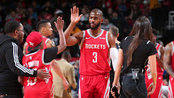 HOUSTON, TX - DECEMBER 19: Chris Paul #3 of the Houston Rockets hi-fives a fan against the Washington Wizards on December 19, 2018 at the Toyota Center in Houston, Texas. NOTE TO USER: User expressly acknowledges and agrees that, by downloading and or using this photograph, User is consenting to the terms and conditions of the Getty Images License Agreement. Mandatory Copyright Notice: Copyright 2018 NBAE (Photo by Ned Dishman/NBAE via Getty Images)
