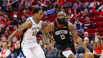 HOUSTON, TEXAS - DECEMBER 22: James Harden #13 of the Houston Rockets drives around DeMar DeRozan #10 of the San Antonio Spurs during the fourth quarter at Toyota Center on December 22, 2018 in Houston, Texas. NOTE TO USER: User expressly acknowledges and agrees that, by downloading and or using this photograph, User is consenting to the terms and conditions of the Getty Images License Agreement. (Photo by Bob Levey/Getty Images)